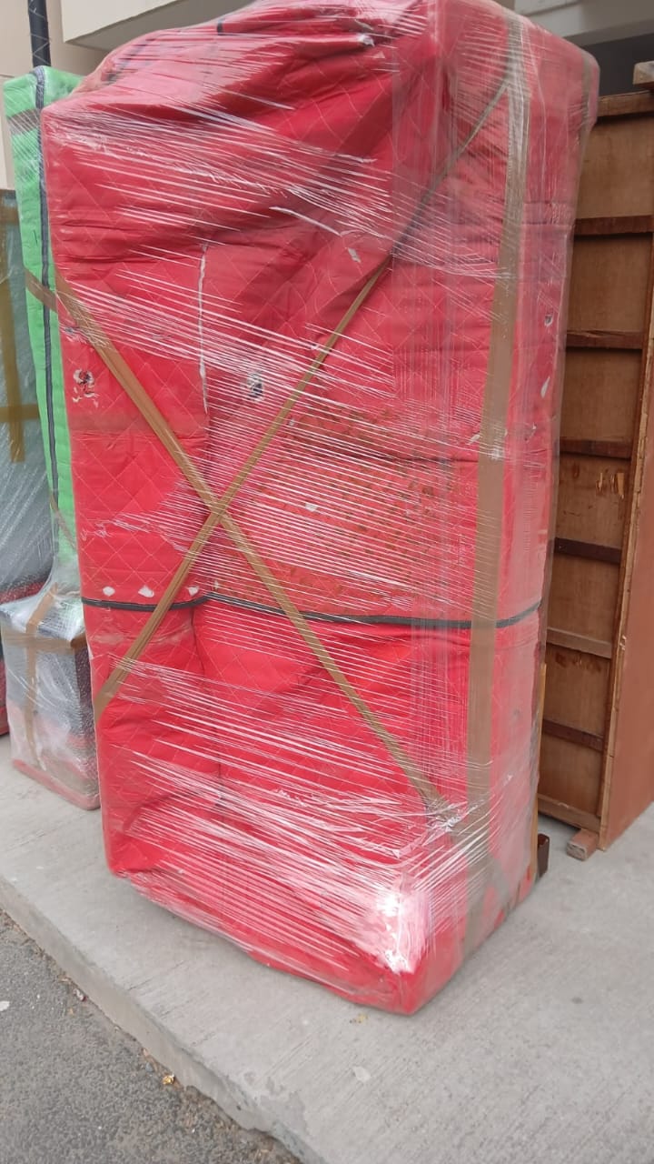 Chhavi Packers and Movers - Bike Being Loaded onto Carrier - Professional Loading Service